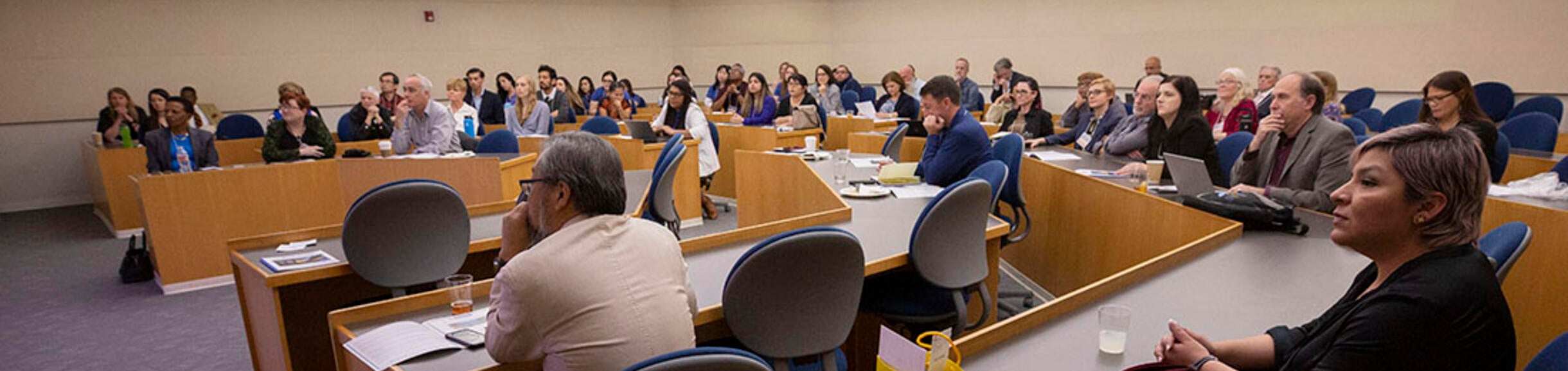 People in a classroom listening to a lecture